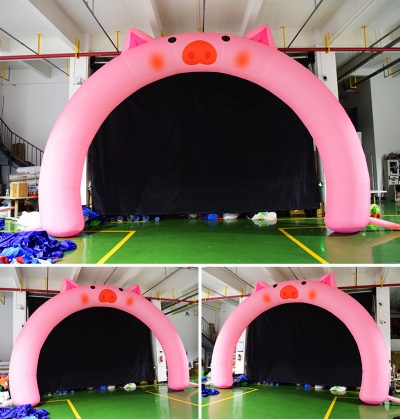 infltable pink pig arch entr...