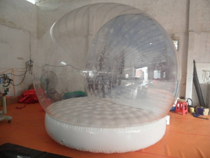 inflatable snow globe for de...