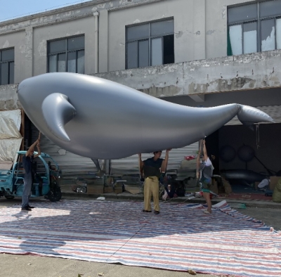 inflatable silver whale ball...