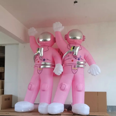 pink inflatable astronaut ca...