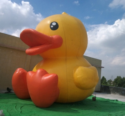 inflatable sitting yellow du...